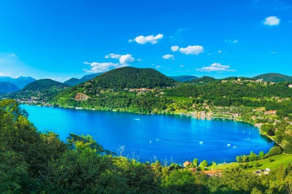 Orta Lake landscape. Orta San Giulio village and Alps mountains view, Piedmont, Italy, Europe.